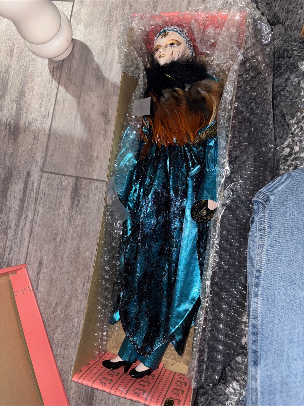 Teal and Black Porcelain Doll with Feather Collar